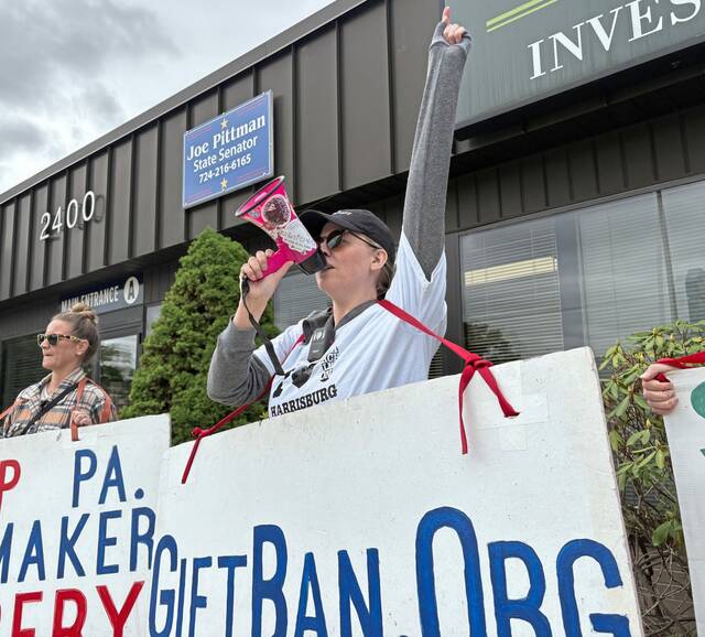 Protesters call for state gift ban and end to Pittsburgh rodeo at Sen. Joe Pittman’s New Kensington office