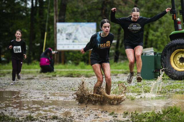 Fun times: Runners who don’t mind getting soaked, filthy relish Seven Springs’ Mud on the Mountain event