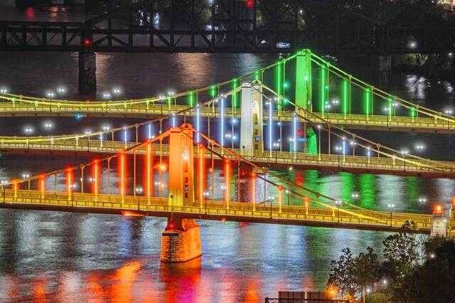 Pittsburgh’s Three Sisters Bridges lit up in colors of Ireland as promotion for new direct flights to Dublin