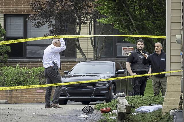 Police, EMS at scene of a shooting in Springdale Township; witness says man handcuffed